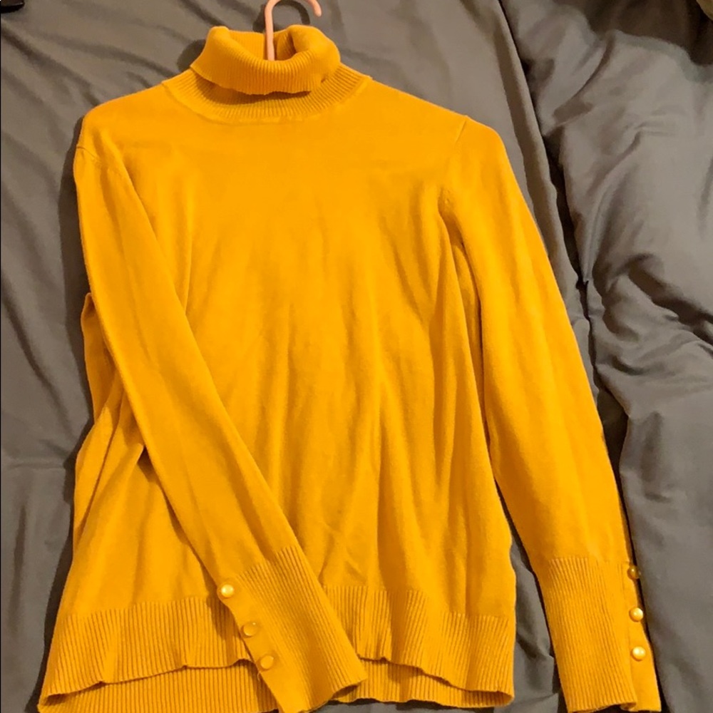 Turtleneck with button sleeve detail